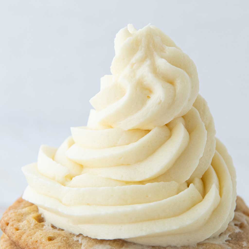 side view swirl of ermine frosting on cookie