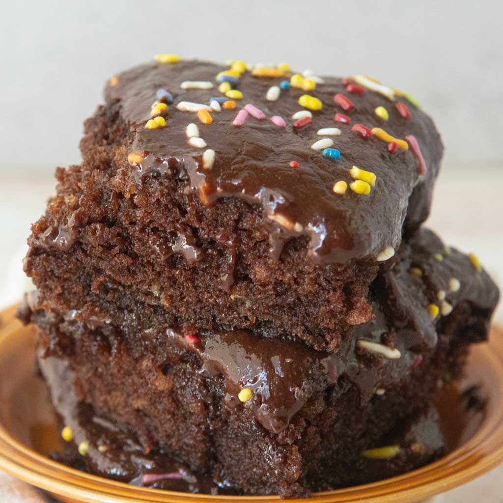 stack of slices of texas sheet cake shown from side