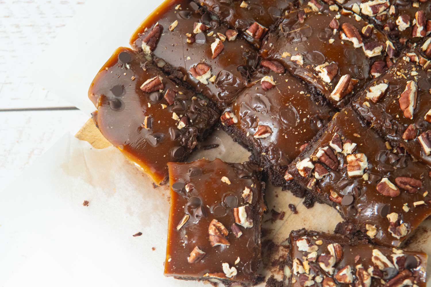 turtle brownies cut on board pulled apart to see texture