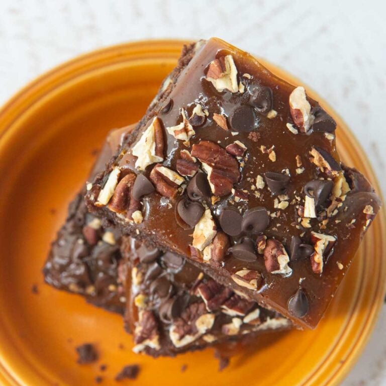 stack of turtle brownies on orange plate