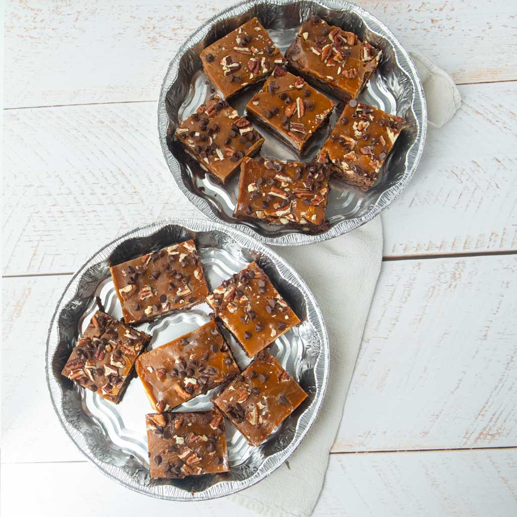 foil pie plates filled with cut turtle brownies