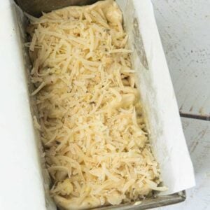 cheese on top of garlic bread loaf