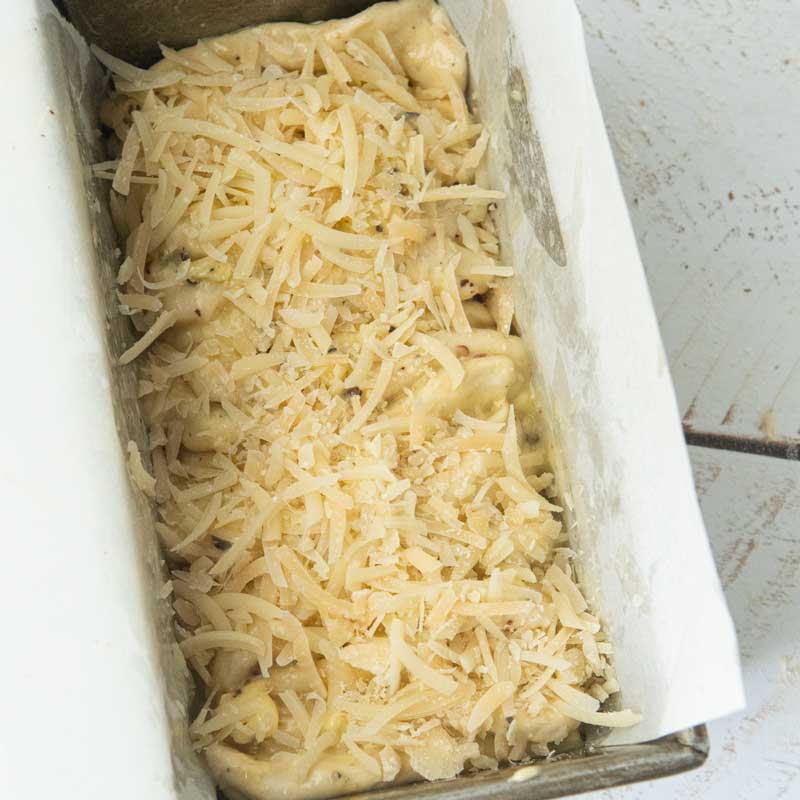 cheese on top of garlic bread loaf