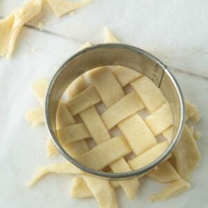  cutting lattice crust for a mini pie with a biscuit cutter