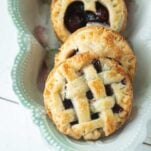 closeup of mini cherry pies in dish