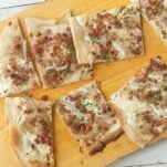 slices of flammkuchen on board