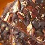 stack of turtle brownies on orange plate, text overlay
