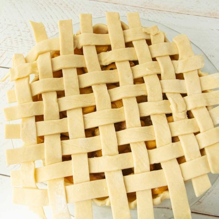 lattice top over peach pie before trimming