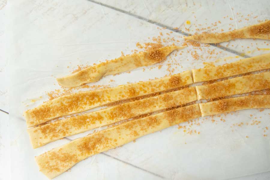 puff pastry strips covered in cinnamon sugar