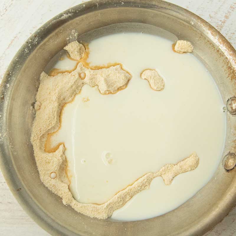 milk and maple sugar in pan