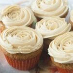 close up of apple butter cupcakes topped with maple buttercream