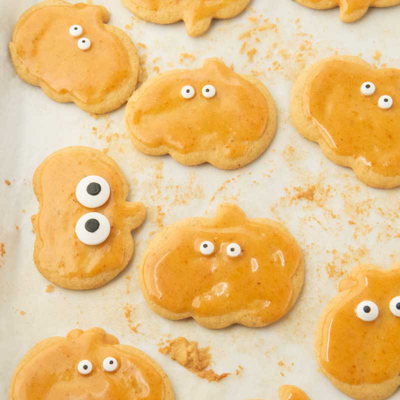 pumpkin iced pumpkin cutout cookies with candy eyes