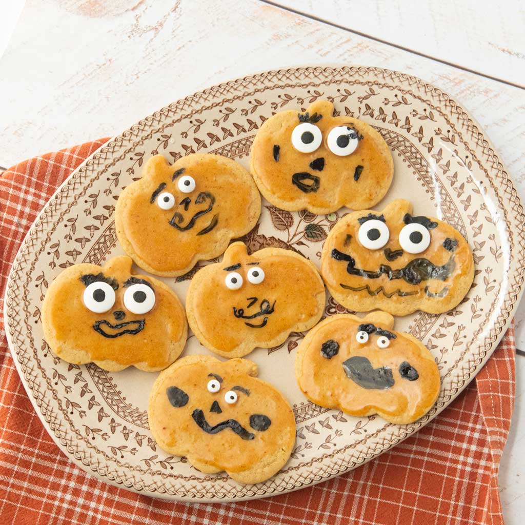 jack-o-lantern cookies on plate