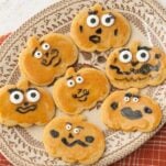closeup of jack-o-lantern cookies on plate